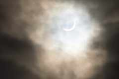 20150320 partial eclipse through cloud
